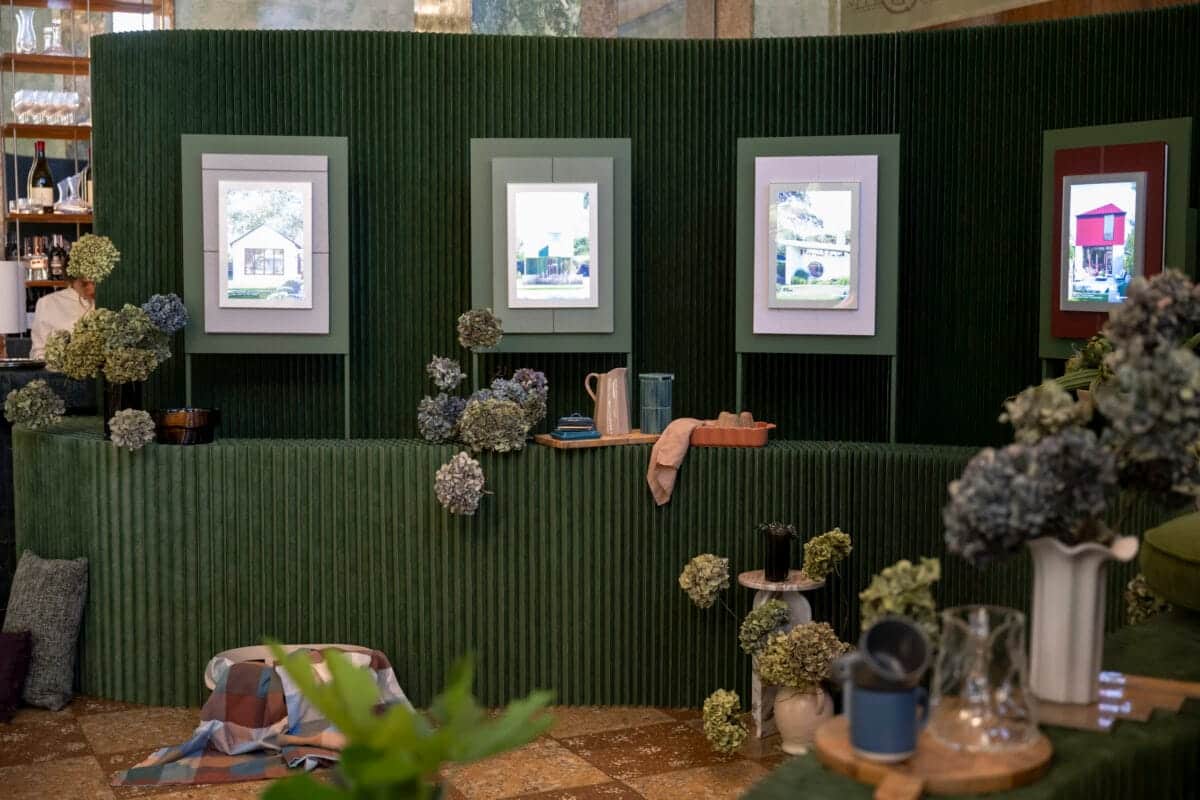 Art gallery nook styled with home decor and hydrangea flowers.