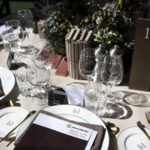 Moody corporate table setting with colours of plum and blue